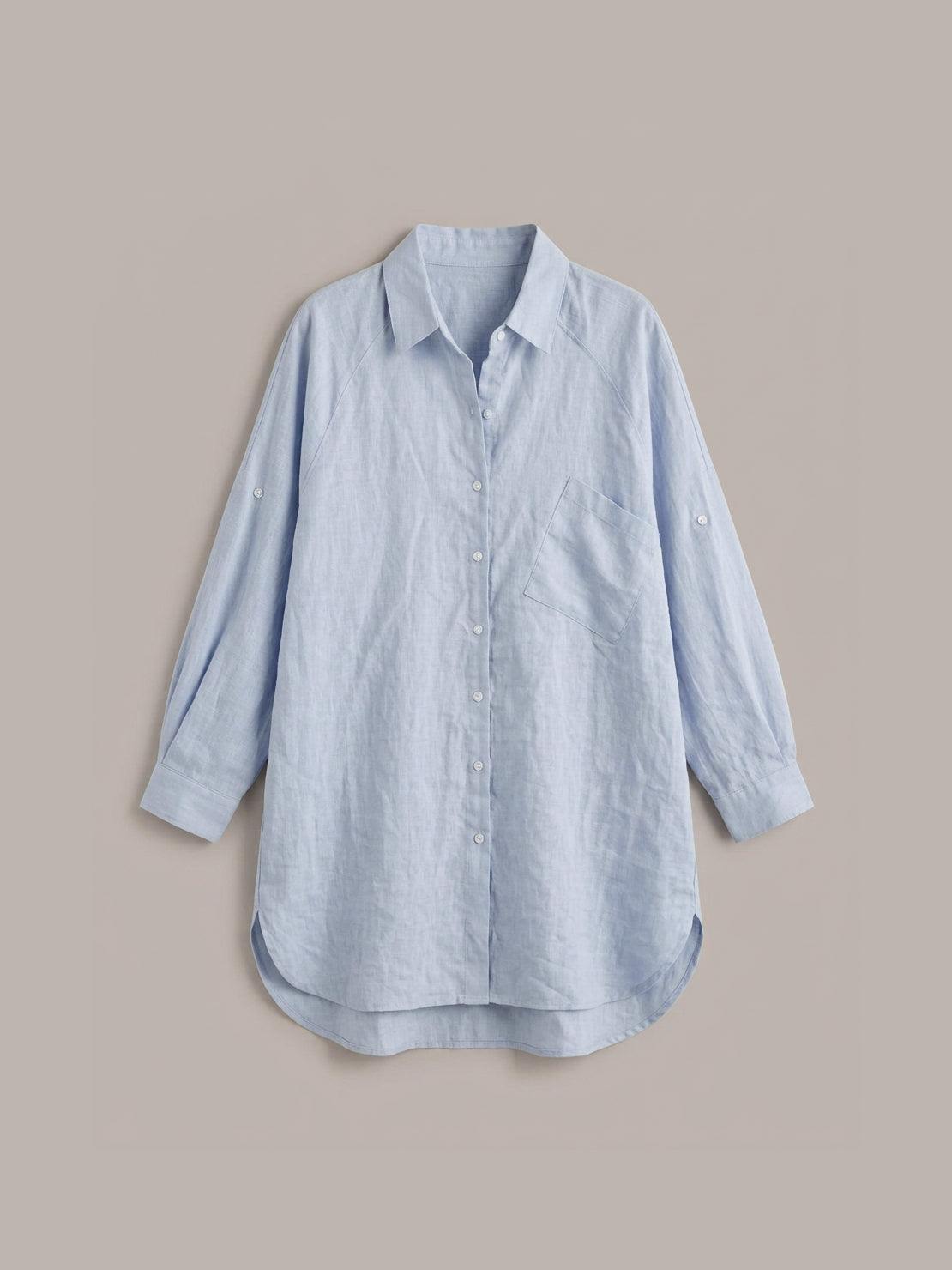 Relaxed oversized cotton linen shirt with dropped shoulders and back pleat detail on white background