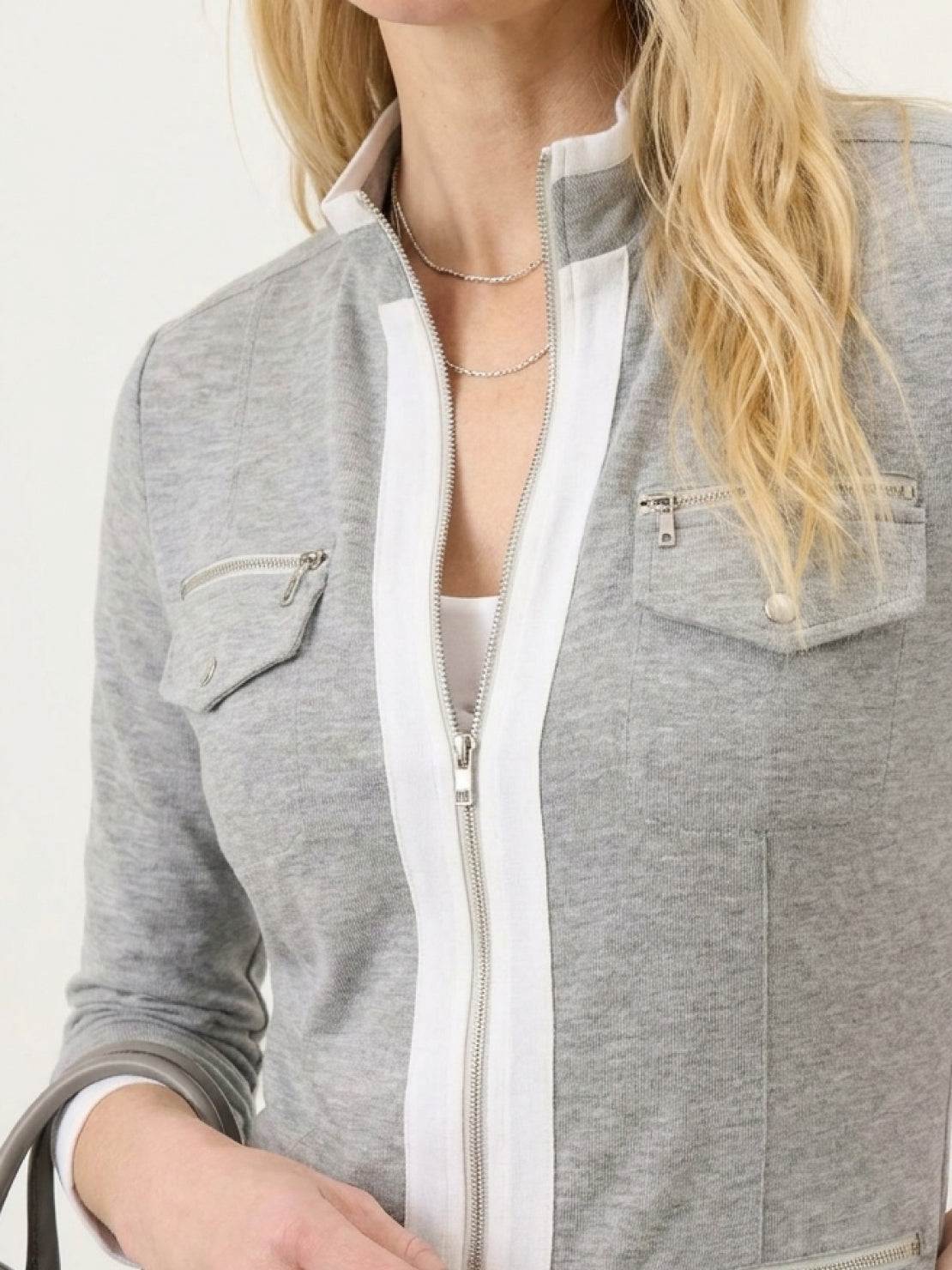 woman wearing sleek contrast zip two-piece outfit with soft stretch fabric