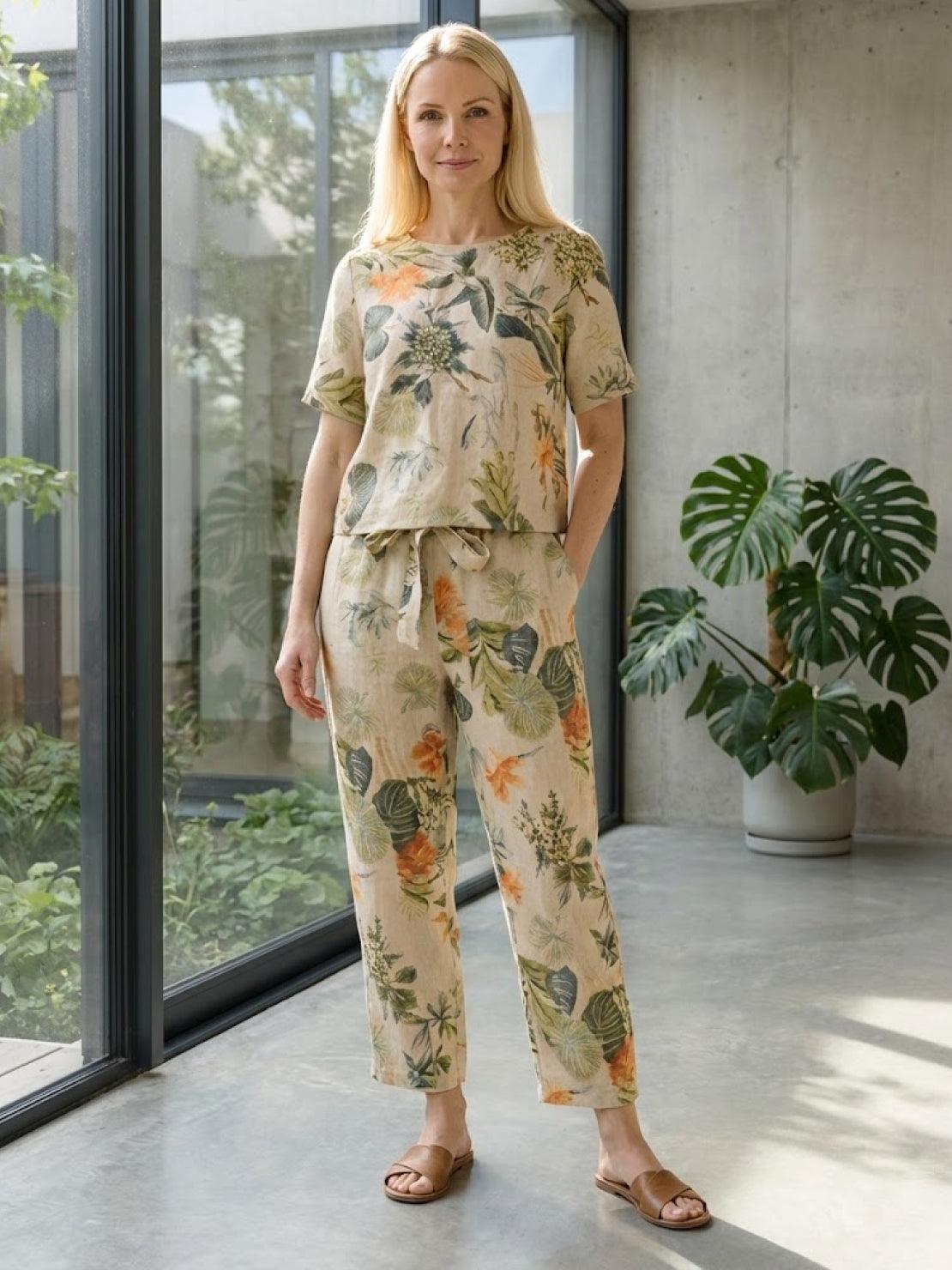 Woman wearing relaxed fit cotton linen set with short-sleeve top and straight-leg pants in monochrome tones