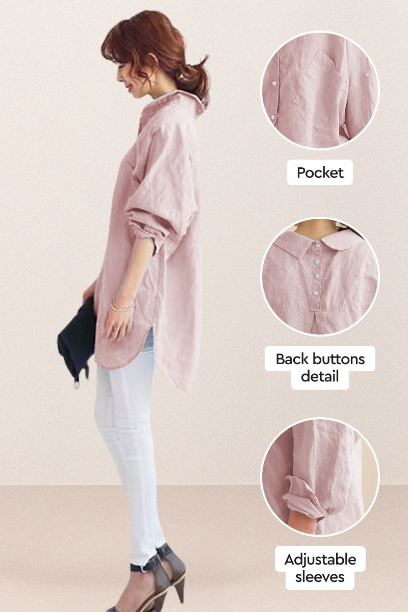 Woman wearing oversized linen shirt in sun-washed pink with back button detail and adjustable sleeves