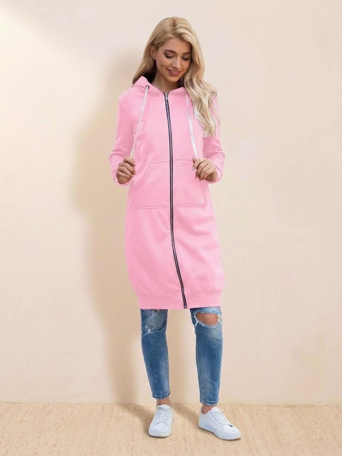 Woman wearing pink oversized long zip sweatshirt hoodie with drawstring hood and front pockets