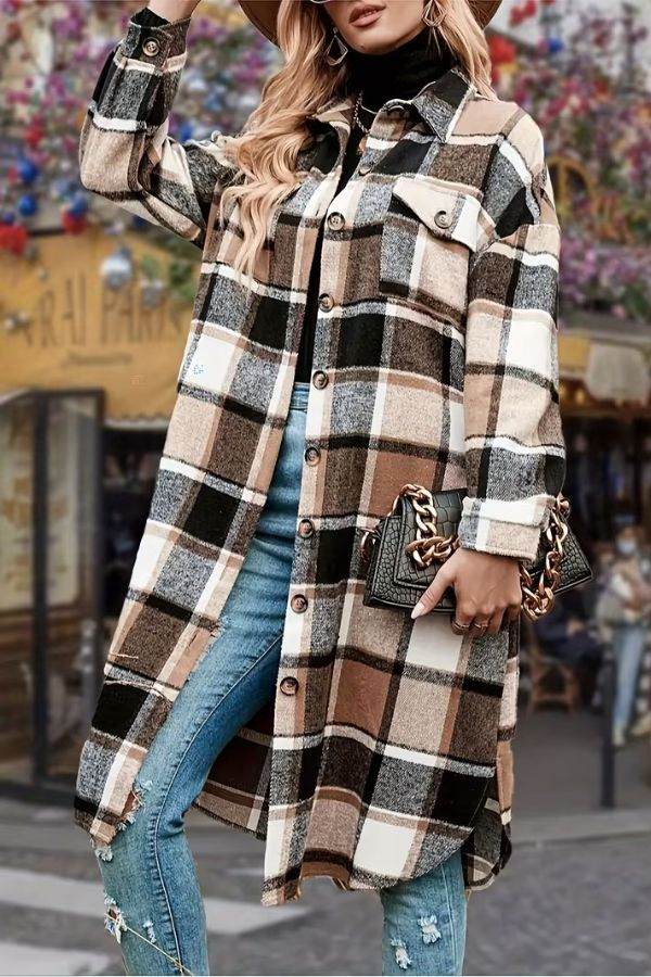 Oversized medium-length plaid overshirt in blue and beige tones styled with jeans and a black turtleneck
