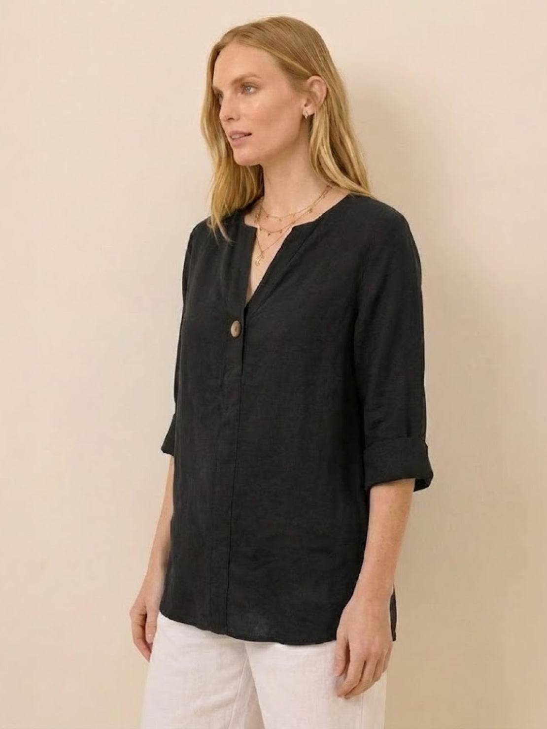 white pure linen age-defying shirt with button details on hanger