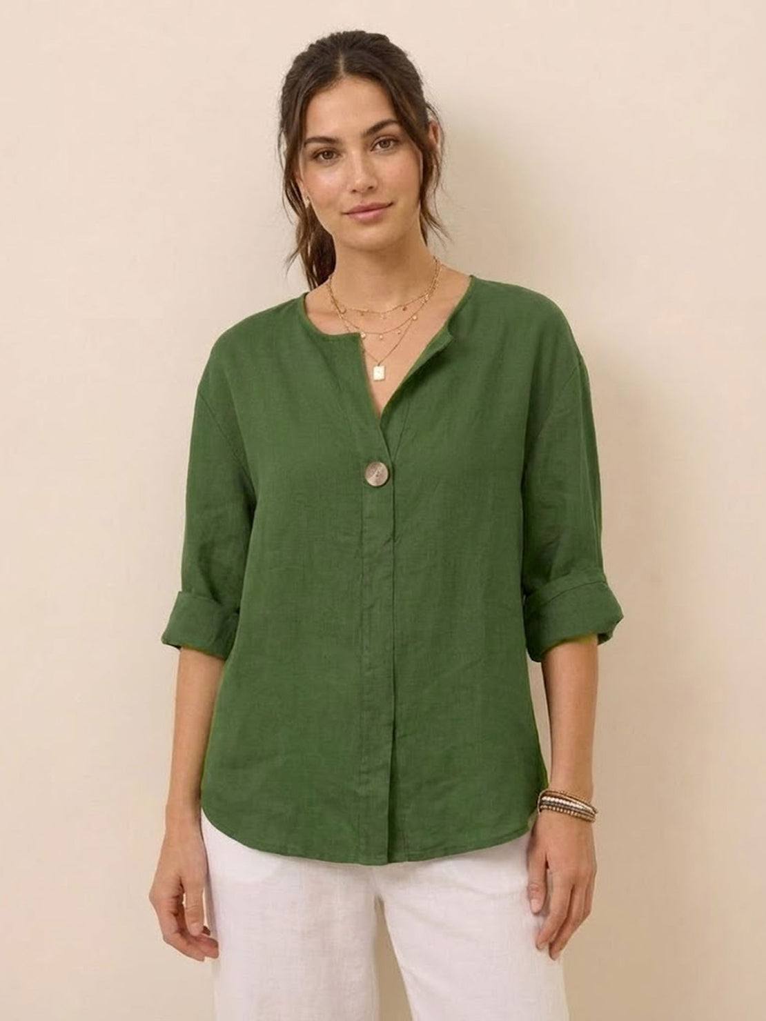 woman wearing pure linen age-defying shirt with button detail standing outdoors