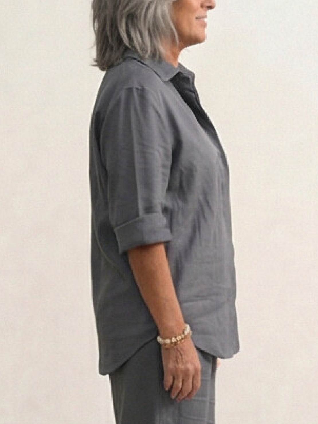 Woman wearing relaxed shirt and trousers two-piece set in casual monochrome style