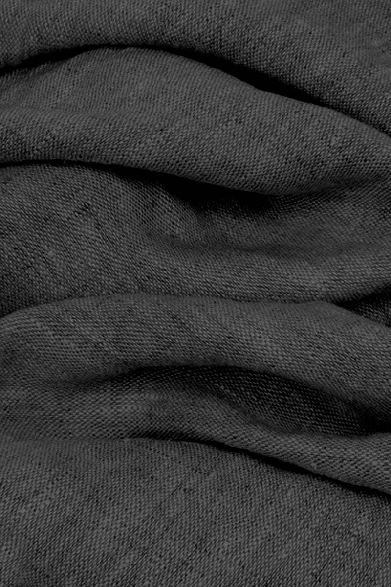 Close-up texture of black 100% cotton linen fabric with soft, breathable, and lightweight appearance.