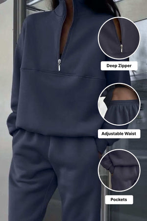 Navy cotton blend tracksuit with deep zipper, adjustable waist, and pockets for tailored comfort and minimalist style.