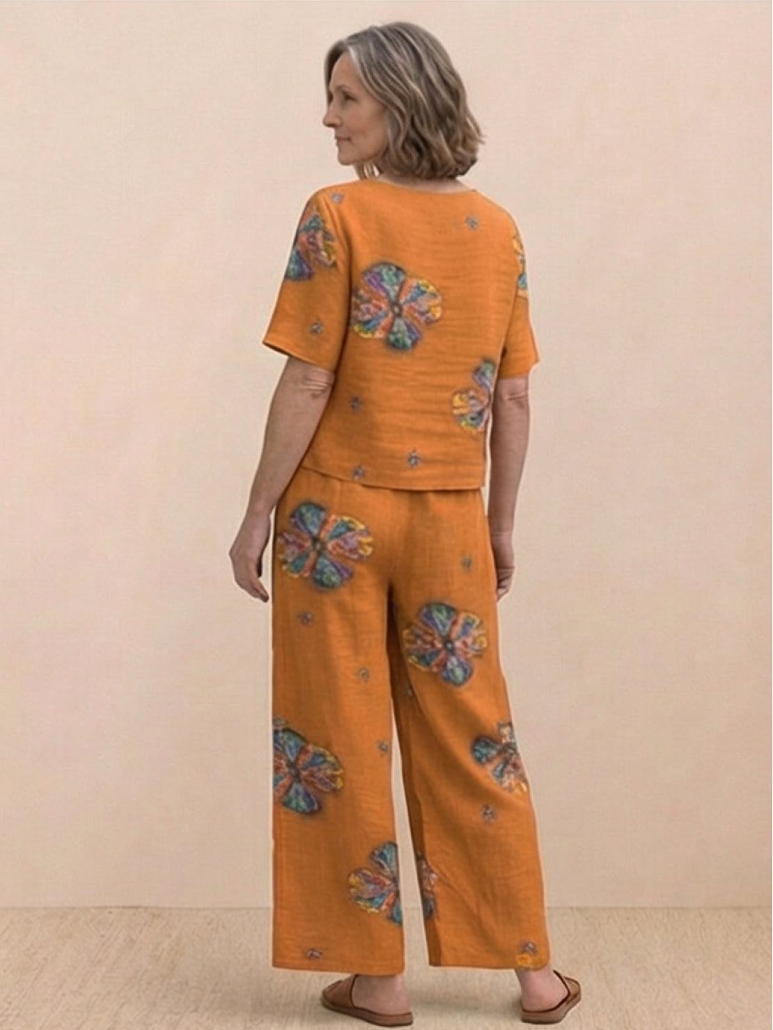 Woman wearing a soft-tailored loose fit co-ord set with wide-leg trousers in a relaxed, breathable fabric