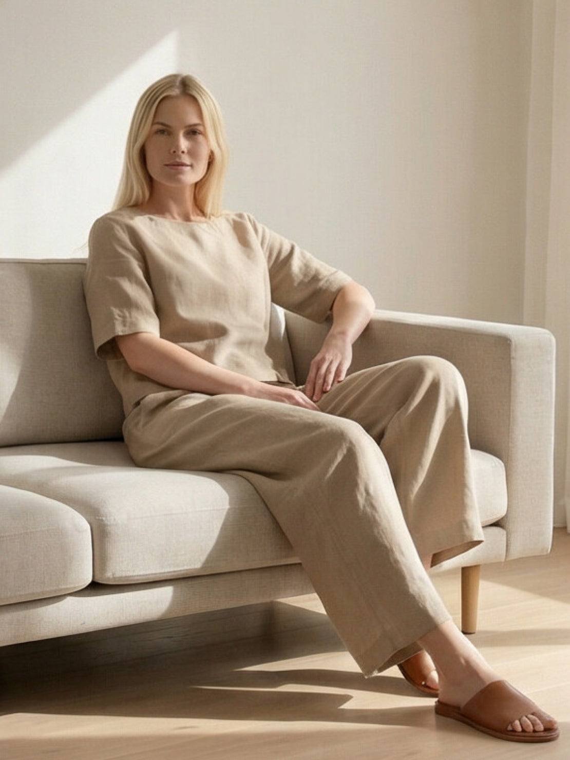 woman wearing loose fit co-ord set with relaxed top and wide-leg trousers in solid color