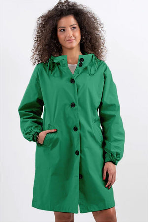 Green oversized Rain Couture Windbreaker jacket with hood and button closure on model