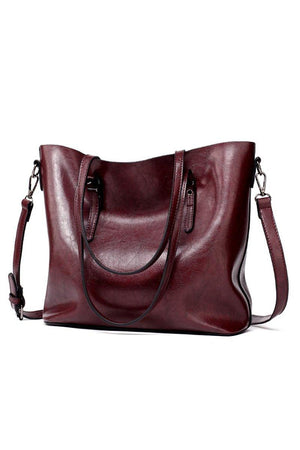 Elegant burgundy multi strap tote bag in PU leather with roomy interior and multiple compartments for versatile use