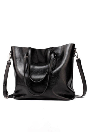 Black multi strap tote shopper bag in PU leather with multiple compartments and adjustable shoulder and crossbody straps