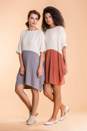 Two women wearing oversized T-shirt dresses in color block design with soft cotton-linen blend fabric