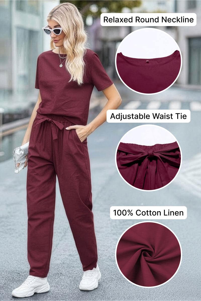 Woman wearing maroon relaxed fit cotton linen set with round neckline and adjustable waist tie, styled with white sneakers and sunglasses
