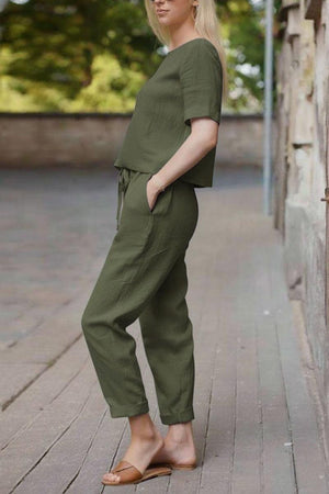 women's olive green cotton linen set with relaxed short sleeve top and straight-leg pants outdoors