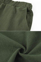 Close-up of soft green fabric texture and pocket detail from 100 cotton linen two-piece set