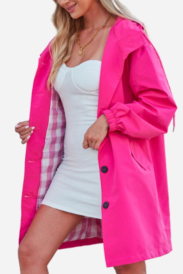 Barbara Pink Raincoat windbreaker jacket with checkered inner lining worn over white dress