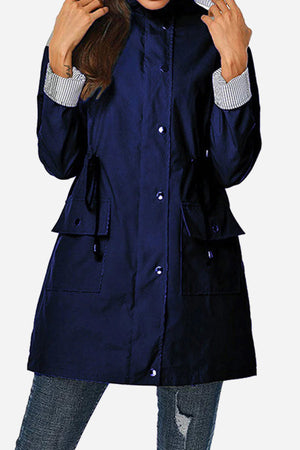 Women's water resistant striped hooded windbreaker jacket with oversized fit and multiple pockets