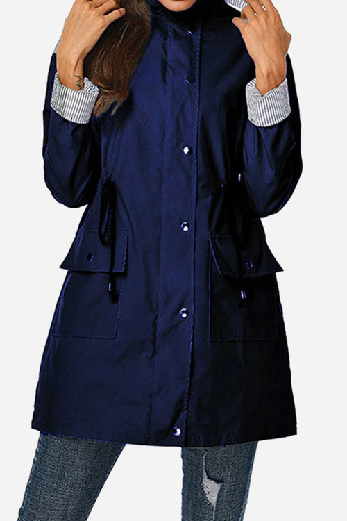 Women's water resistant striped hooded windbreaker jacket with oversized fit and multiple pockets