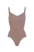 Seamless nude TummyToning Bodysuit with tummy control and adjustable straps for a smooth, toned silhouette