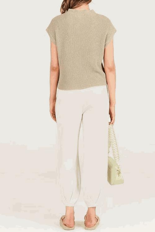 Comfy Couture Knit Sweater two-piece set with beige knit pullover and white high-waisted pants back view