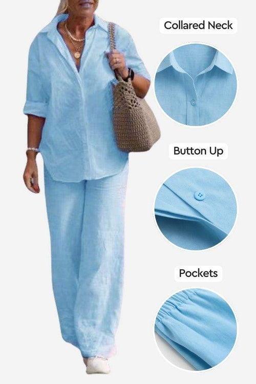 Woman wearing light blue relaxed shirt and trousers two-piece set with collared neck, button-up front, and side pockets, styled casually with a beige bag.