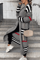 Cozy striped long knitted cardigan with oversized fit and soft fabric for stylish warmth