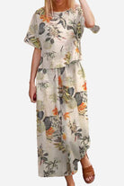 Floral print loose fit co-ord set with wide short sleeves top and wide-leg trousers.
