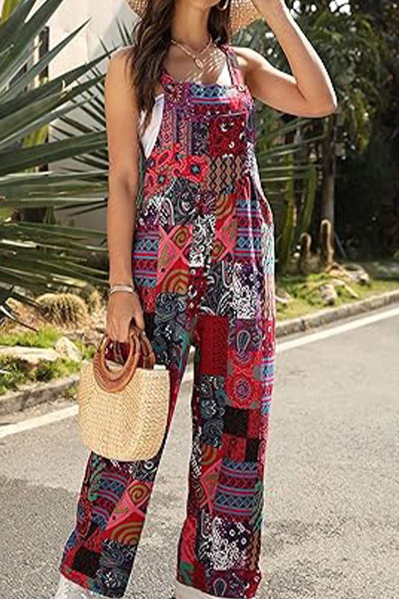 Woman wearing vibrant Bohemian Fantasy Overalls with colorful patchwork print outdoors carrying a woven handbag