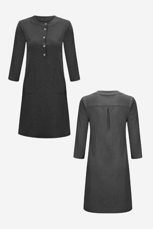 Black cotton dress with 3/4 sleeves, front buttons, and waist seam detailing shown from front and back