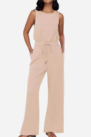beige sleeveless wide leg pants jumpsuit with drawstring waist and pockets for comfortable stylish wear