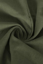 close-up of olive green cotton fabric for V-neck cotton two-piece trouser set
