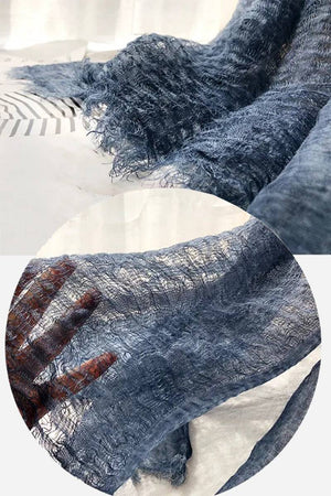 Lightweight linen scarf in breathable soft fabric with frayed edges and airy texture
