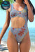 Seamless anti-tan line one-piece cutout swimsuit with tan-through technology and floral pattern at beach