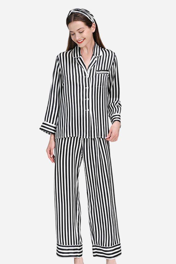 Woman wearing 100% mulberry silk striped long sleeve pajama set with matching pants and headband