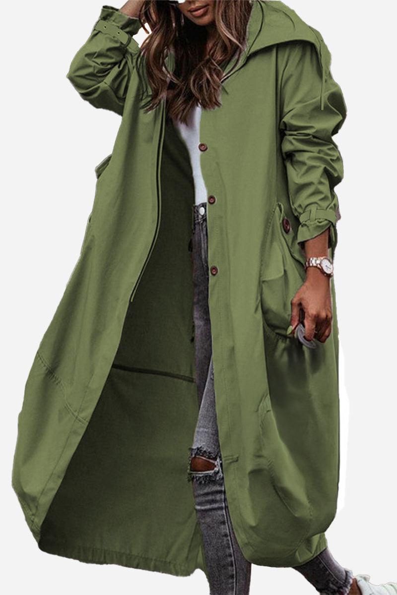 Olive green minimalist hooded coat with oversized fit and button closure, perfect for travel and layering.