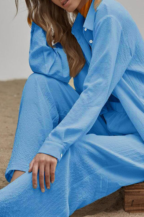 Lightweight blue linen blend two-piece set with long sleeves and wide-leg pants, perfect for travel and easy-care wear