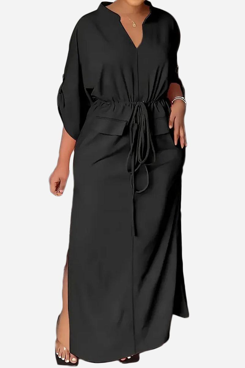 Elegant black All-Day Drape Dress with adjustable waist tie, front slit, and button-tab sleeves for versatile comfort and style