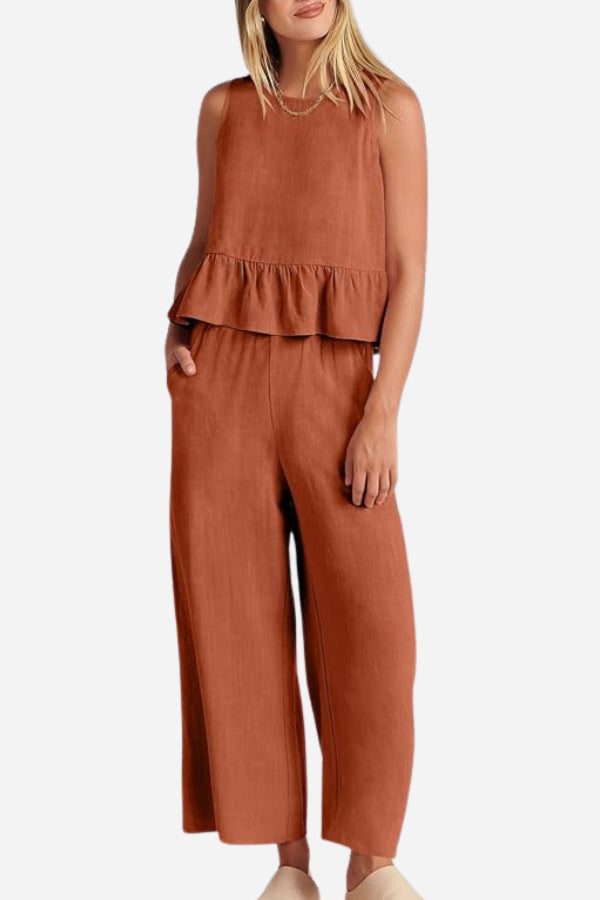 Rust-colored linen-like feel women's two-piece set with sleeveless ruffled top and wide-leg pants.