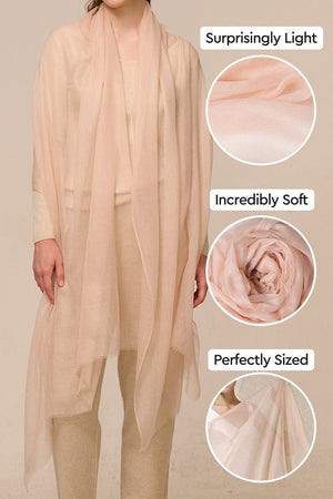 100 Cashmere Featherlight scarf showing soft, light, and perfectly sized beige cashmere fabric worn by a person