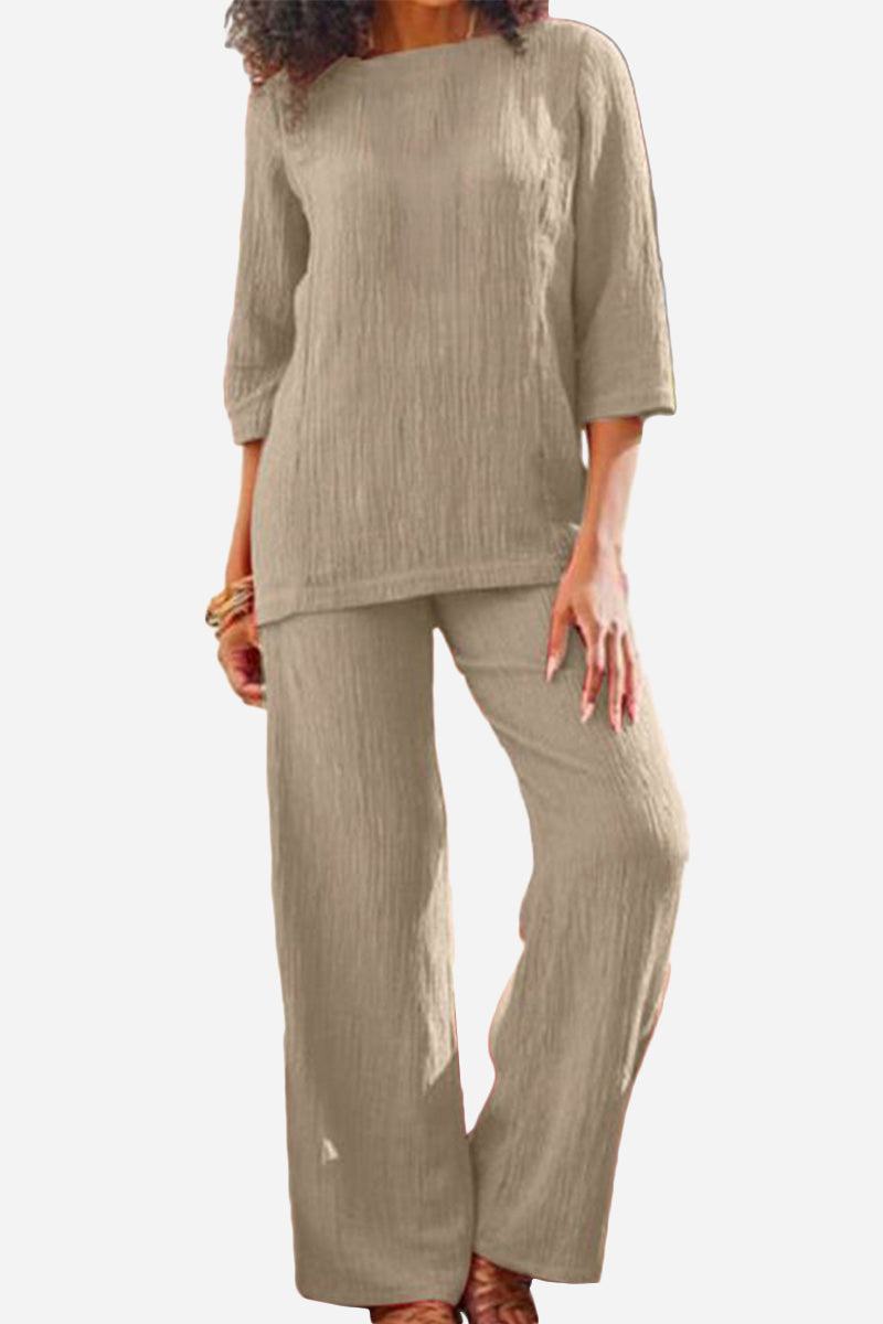 Woman wearing beige textured two-piece set with loose fit and three-quarter sleeves