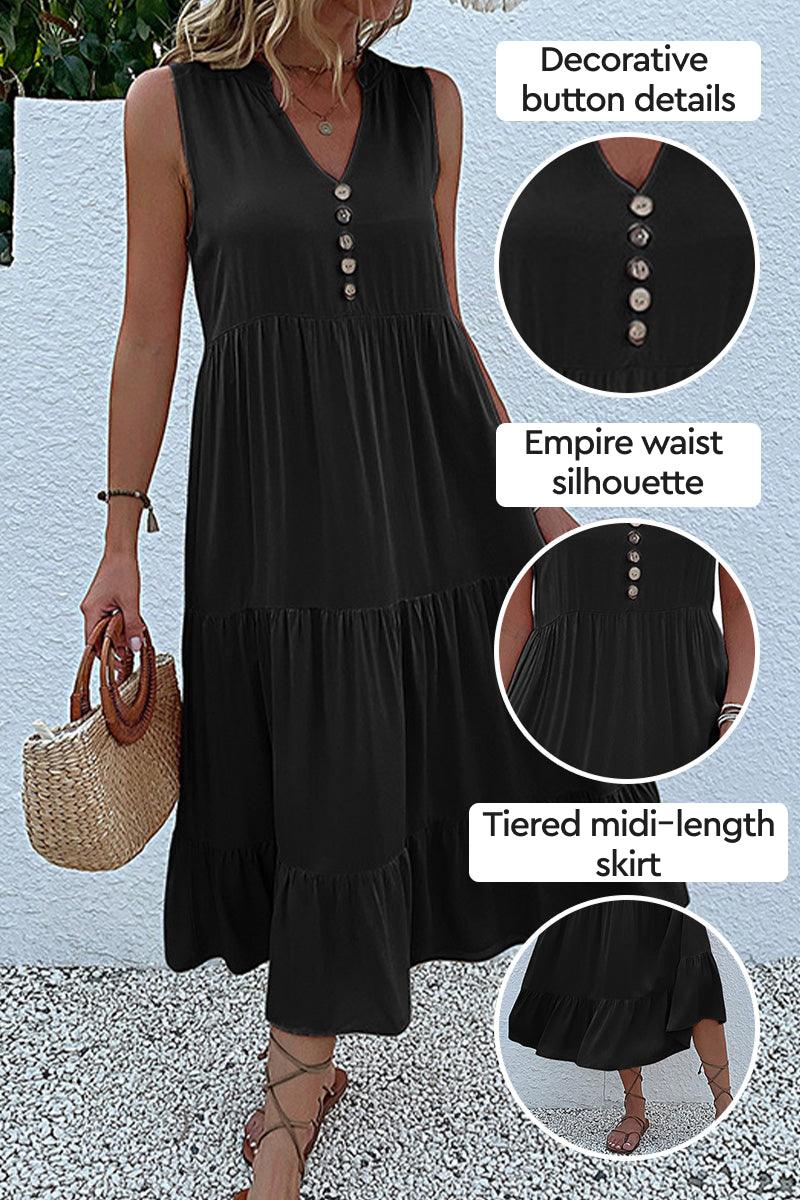Bohemian tiered midi dress in black with V-neck, button detail, empire waist, and flowing tiered skirt.