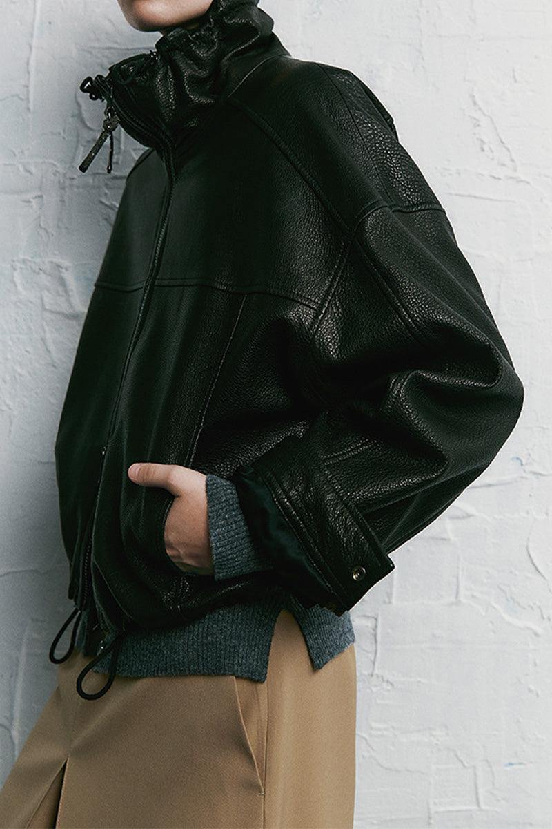 Black genuine sheepskin leather jacket with glossy finish and adjustable waist for a perfect fit