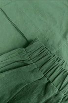 100% cotton green two-piece set with round neck top and wide-leg pants, soft breathable fabric, comfortable fit for travel and casual wear