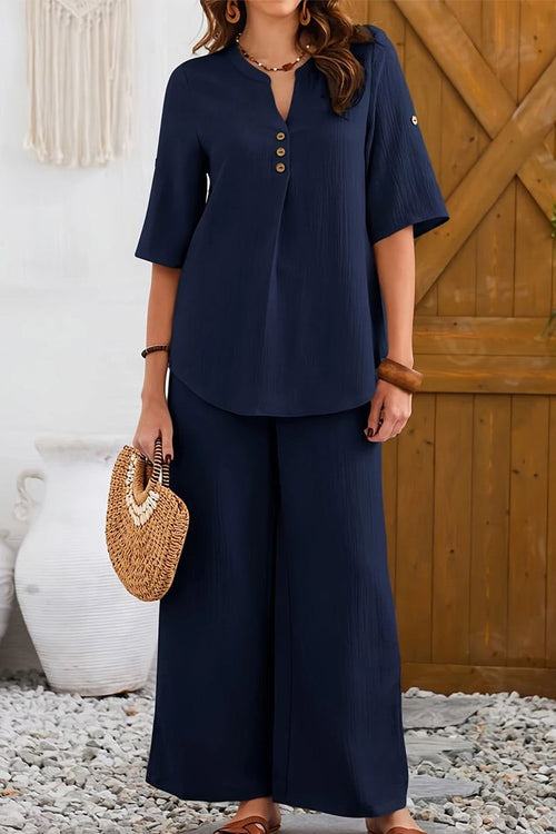Navy wrinkle-free wide leg pants and button-front top set for comfortable stylish travel wear