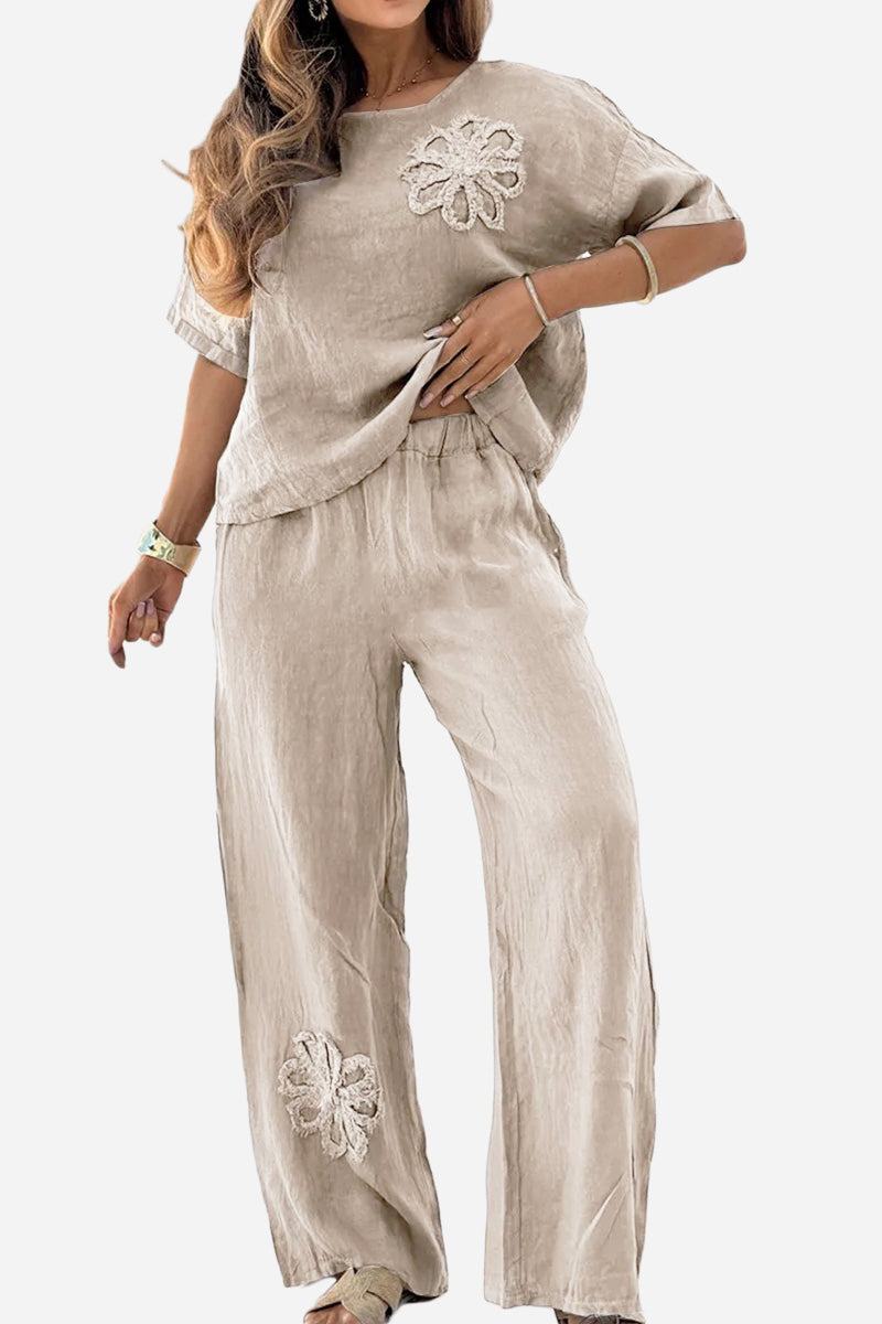 Beige Riviera Petal two-piece set with floral embroidery, featuring a loose-fitting top and wide-leg pants for comfortable, stylish wear.