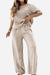 Beige Riviera Petal two-piece set with floral embroidery, featuring a loose-fitting top and wide-leg pants for comfortable, stylish wear.