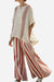 Santorini Sunset Striped two-piece set with flowing wide-leg pants and loose top in beige and rust stripes