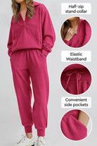 Unisex half-zip pullover and sweatpants set in pink with stand collar, elastic waistband, and side pockets.