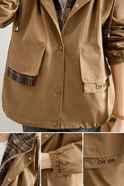 Brown City Explorer Plaid Windbreaker with plaid lining, adjustable hood, elastic cuffs, and front flap pockets for women